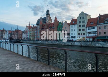 Gdansk, Poland - 05.06.2017: Cityscape of a Baltic sea port viewed from wooden walk by the canal. Traditional colorful houses in Gdansk, Poland. Stock Photo