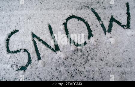 Eton Wick, Windsor, Berkshire, UK. 9th February, 2021. A snow day. There was a light dusting of snow in Eton Wick this afternoon as the temperature remained below zero all day. Temperatures later this week are forecast to be the coldest in 10 years. Credit: Maureen McLean/Alamy Live News Stock Photo