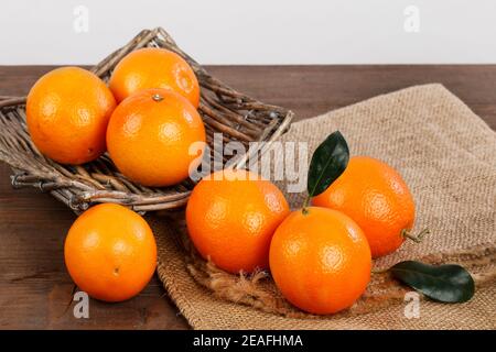 Fresh oranges on wooden table. Healthy food Stock Photo