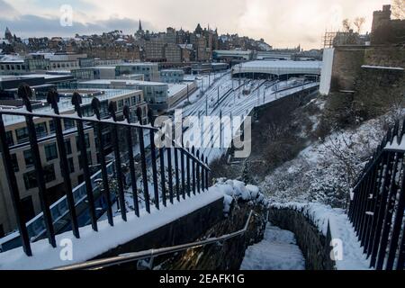 A view of a train leaving Waverley Station in Edinburgh after a snowstorm Stock Photo