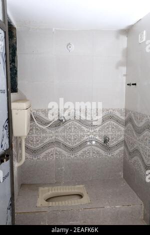 An Indian style toilet in a ready to stay apartment Stock Photo