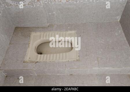 An Indian style toilet in a ready to stay apartment Stock Photo