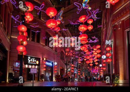 Hong Kong, China. 09th Feb, 2021. Pedestrians walk under hundreds of red lanterns hanged from the ceiling at Lee Tung Avenue in Hong Kong to celebrate the Chinese Lunar New Year festival and the year of the Ox. Credit: SOPA Images Limited/Alamy Live News Stock Photo