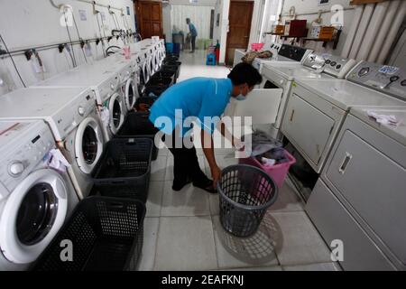 https://l450v.alamy.com/450v/2eafknj/bogor-indonesia-06th-feb-2021-a-worker-loads-laundry-into-a-washing-machine-at-a-laundry-company-in-bogor-west-java-on-february-6-2021-bogors-laundry-is-a-commercial-laundry-service-for-hotels-industrials-home-the-covid-19-pandemic-has-affected-the-laundry-business-sector-on-the-national-and-global-economies-is-unprecedented-photo-by-adrianina-photo-agencysipa-usa-credit-sipa-usaalamy-live-news-2eafknj.jpg