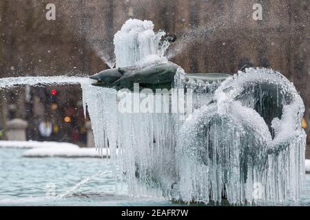 London, UK.  9 February 2021. UK Weather:  An ice covered frozen fountain in Trafalgar Square during light snow flurries as the cold weather brought on by Storm Darcy continues. Credit: Stephen Chung / Alamy Live News Stock Photo