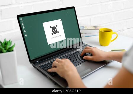Hacked warning on laptop computer concept. Concept of data protection and security Stock Photo