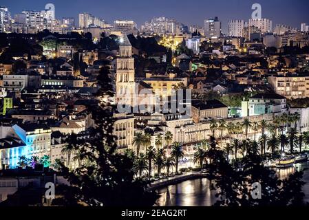 Split at night, Croatia. Famous illuminated city with roman architecture, travel destination. View from the Marjan park. Stock Photo