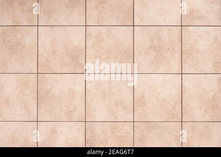 Beige ceramic tile background on the floor, bathroom design element, abstract square pattern, brown geometric texture, vintage wall surface Stock Photo