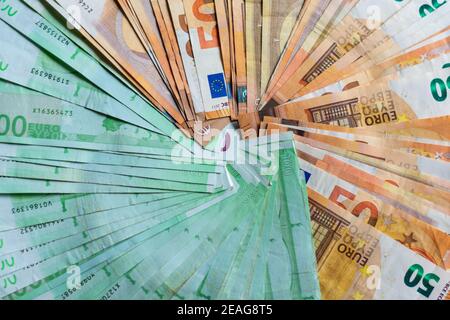 Many hundred and fifty euro bills forming a background circle Stock Photo