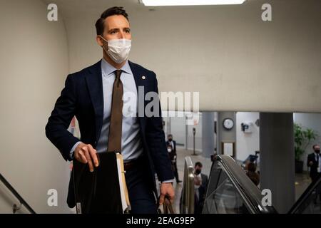 United States. 9th Feb, 2021. Sen. Josh Hawley, R-Mo., walks through the Senate subway on the first day of former President Donald Trump's second impeachment trial at the U.S. Capitol in Washington on Tuesday, Feb. 9, 2021. Trump is charged with “incitement of insurrection” after his supporters stormed the Capitol in an attempt to overturn November's election result. Credit: Caroline Brehman/Pool Via Cnp/Media Punch/Alamy Live News