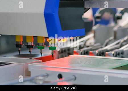 Process of selective soldering components to printed circuit boards at factory Stock Photo