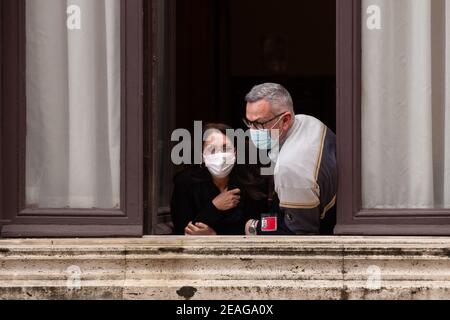 Rome, Italy. 09th Feb, 2021. People looking out the window to see Silvio Berlusconi (Photo by Matteo Nardone/Pacific Press) Credit: Pacific Press Media Production Corp./Alamy Live News Stock Photo