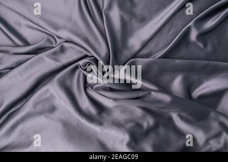 wavy rippled gray blue purple silk satin fabric background Stock Photo