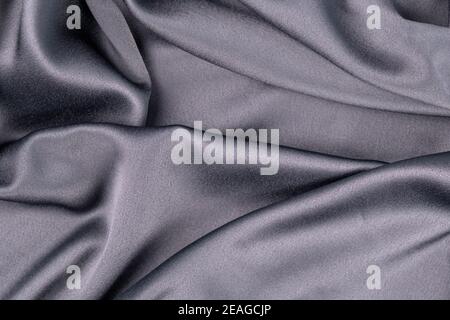 wavy rippled gray blue purple silk satin fabric background Stock Photo