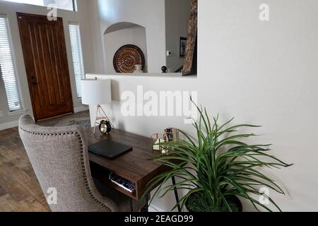 A home office in the living room of a house. Stock Photo