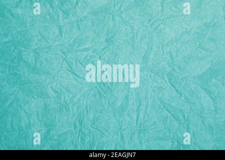 Old crumpled turquoise paper background texture Stock Photo