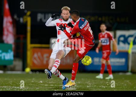 Standard's Joao Klauss De Mello and Kortrijk's Faiz Selemani fight for the ball during a soccer game between KV Kortrijk and Standard de Liege (both f Stock Photo