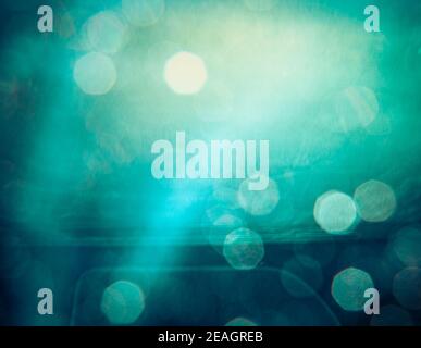 blue green bokeh pattern with light ray through a car window Stock Photo