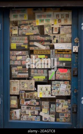 AJAXNETPHOTO. PARIS, FRANCE. - DOOR STAMPS - DOOR WINDOW DISPLAY OF STAMP DEALER'S SHOP. PHOTO:JONATHAN EASTLAND/AJAX REF:D1X82712 1862 Stock Photo