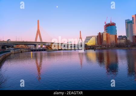 Boston Leonard P. Zakim Bunker Hill Memorial Bridge and Charles River at sunset with twilight, Boston, Massachusetts MA, USA.