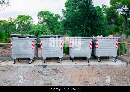 Metallic garbage containers in a natural recreation area for hikers to deposit their waste. Stock Photo