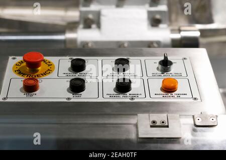 Push buttons on a control panel of an industrial machine. Selective focus. Stock Photo