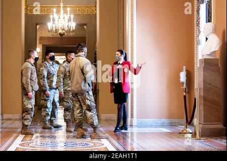Washington, DC, USA. 9th Feb, 2021. February 9, 2021 - Washington, DC, United States: National Guard troops with a U.S. Capitol tour guide (red jacket) while touring the United States Capitol. Credit: Michael Brochstein/ZUMA Wire/Alamy Live News
