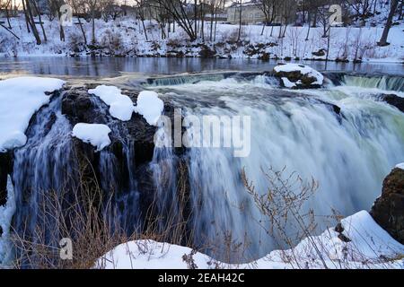 PATERSON, NJ -6 FEB 2021- Winter view of the Great Falls of the Passaic River, part of the Paterson Great Falls National Historical Park in New Jersey Stock Photo