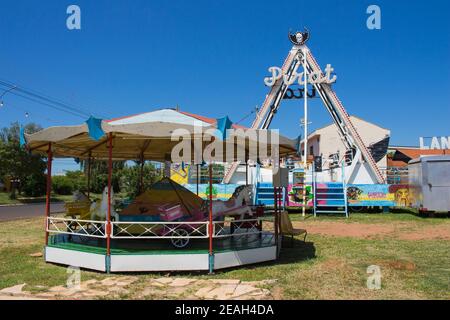 Ibitinga, SP, Brazil - 02 07 2021: Pirate ship and carousel at a amusement park Stock Photo