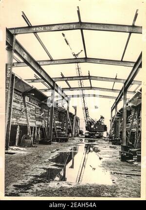 FRAUREUTH, EAST GERMANY - MAY 20, 1965: The retro photo shows construction site in Communist bloc. Historical crane truck. Former East Germany, 1960s. Stock Photo