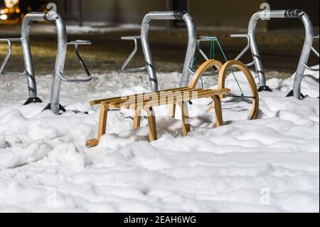 Berlin, Germany. 09th Feb, 2021. A sled was hooked up to empty bike racks outside a supermarket. Credit: Kira Hofmann/dpa-Zentralbild/dpa/Alamy Live News