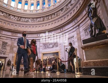 Washington, United States. 09th Feb, 2021. U.S. Rep. Eric Swalwell D-CA, and Delegate Stacey Plaskett from the Virgin Islands, walk in the Rotunda of the U.S. Capitol following a 56-54 procedural vote on the first day of the Senate trial in Washington, DC on Tuesday, February 9, 2021. Impeachment managers are working at making the case that Trump was 'singularly responsible' for the January 6th attack at the U.S. Capitol and he should be convicted and barred from ever holding public office again. Photo by Ken Cedeno/UPI Credit: UPI/Alamy Live News Stock Photo