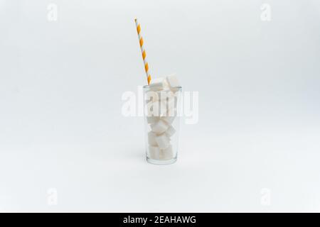 sugar in a glass with a straw cocktail sweets energy Stock Photo