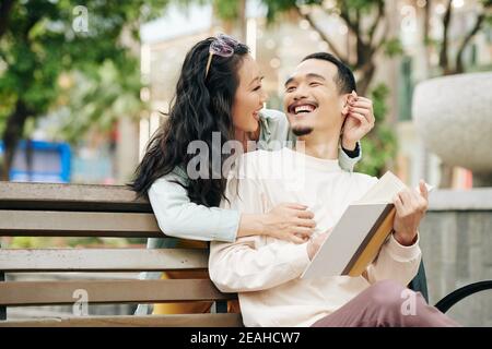 Woman surprising boyfriend Stock Photo