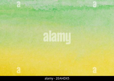 Abstract watercolor hand painted green yellow paper background. Stock Photo