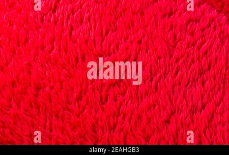 Saturated bright dark red background texture fabric felt Stock Photo