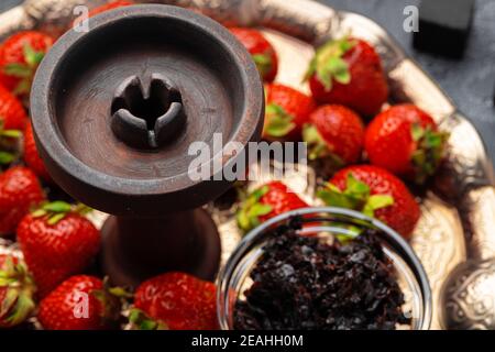 Empty hookah shaft close up on table with fresh fruit Stock Photo