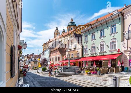 MELK, AUSTRIA - JULY 21, 2019: Restaurants with gardens on Town Hall Square on sunny summer day, Melk, Austria. Stock Photo