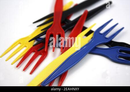 Closeup shot of a set of colored plastic forks isolated on a white background Stock Photo