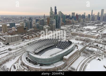 An aerial view of a snow-covered Soldier Field and the downtown skyline, Sunday, Feb. 7, 2021, in Chicago. Stock Photo