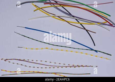 Colorful vinyl aluminum cables on white background as industrial background Stock Photo