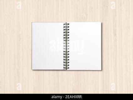 Blank open spiral notebook isolated on white wood Stock Photo