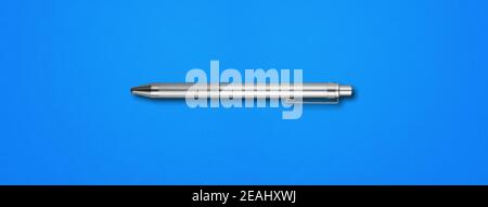 Metal pen isolated on blue background Stock Photo