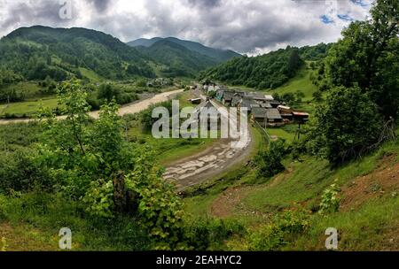 Rural landscape. An old village in a picturesque place among the hills