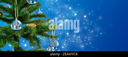 a Christmas tree adorned with christmas bauble made from glass Stock Photo