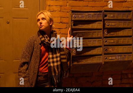 Young woman at the porch at night. Stock Photo