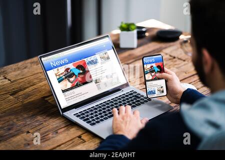 Read Online News Media On Laptop Stock Photo
