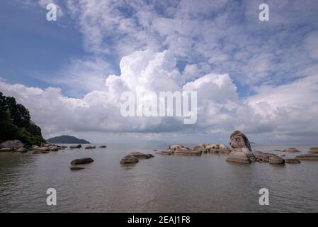 Coastal rock beside the beach at Permatang Damar Laut Stock Photo