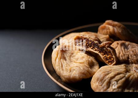 Dried figs on a black background Stock Photo