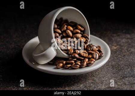 Roasted coffee beans in cup. Stock Photo